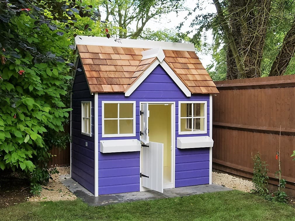Otter Cottage, the original bespoke garden playhouse, within its own garden gate